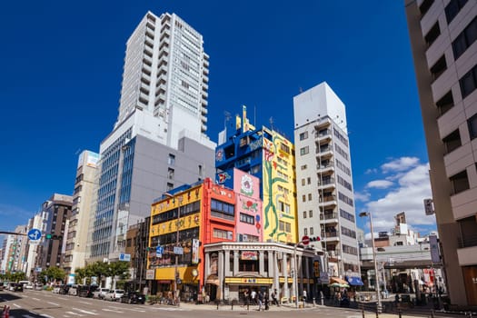 OSAKA, JAPAN - SEPTEMBER 26 2024: The trendy and fashionable Amerikamura district on a clear autumn day in Osaka, Japan