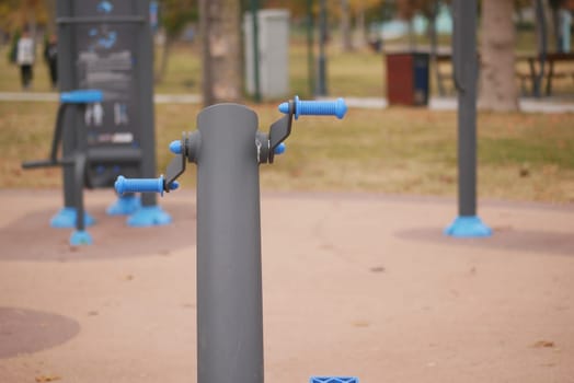 A modern exercise station designed for conducting outdoor workouts conveniently located in a park