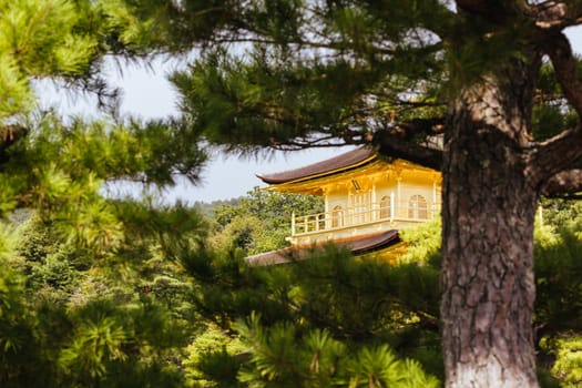 The world famous Kinkakuji Temple (The Golden Pavilion) in Kyoto, Japan on a warm autumn morning