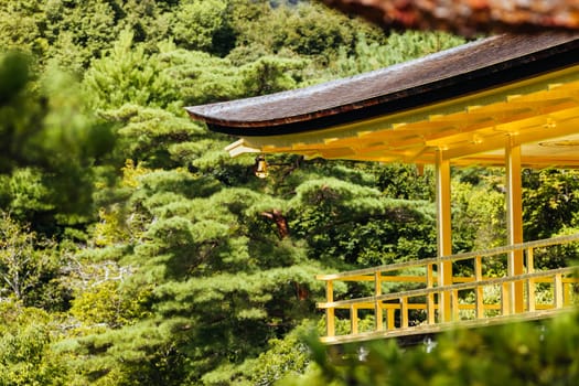 The world famous Kinkakuji Temple (The Golden Pavilion) in Kyoto, Japan on a warm autumn morning