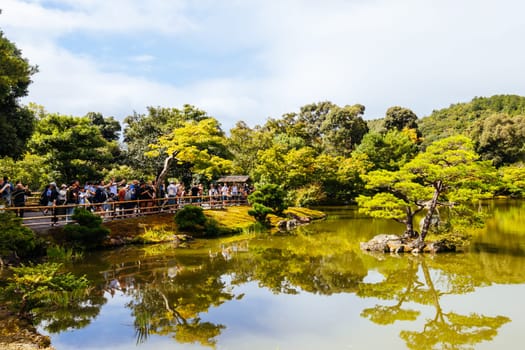 The world famous Kinkakuji Temple (The Golden Pavilion) in Kyoto, Japan on a warm autumn morning
