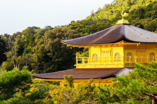 The world famous Kinkakuji Temple (The Golden Pavilion) in Kyoto, Japan on a warm autumn morning
