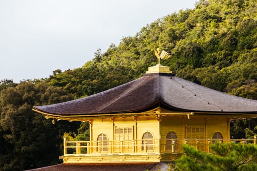 The world famous Kinkakuji Temple (The Golden Pavilion) in Kyoto, Japan on a warm autumn morning