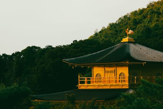 The world famous Kinkakuji Temple (The Golden Pavilion) in Kyoto, Japan on a warm autumn morning
