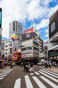 OSAKA, JAPAN - SEPTEMBER 26 2024: The trendy and fashionable Amerikamura district on a clear autumn day in Osaka, Japan