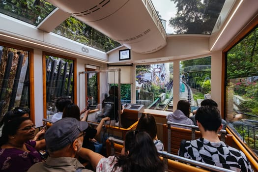 HONG KONG, CHINA - SEPTEMBER 29, 2024: The famous and popular Peak Tram as it ascends Victoria Peak in Hong Kong, China