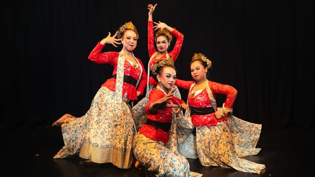 A group of traditional Balinese dancers showed the harmony of the dancers' movements in red uniforms creating stunning visuals on stage