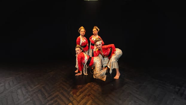 A group of traditional Balinese dancers showed the harmony of the dancers' movements in red uniforms creating stunning visuals on stage