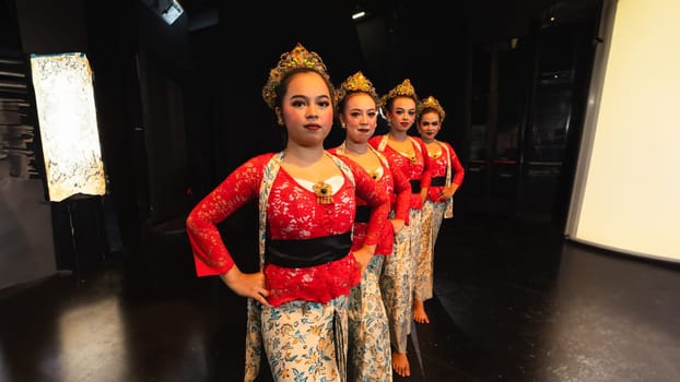 A group of traditional Balinese dancers showed the harmony of the dancers' movements in red uniforms creating stunning visuals on stage