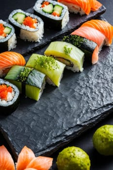 Beautifully arranged sushi selection with fresh fish, vibrant vegetables, and rice. Perfect for showcasing Japanese cuisine, appealing to food enthusiasts and culinary professionals alike