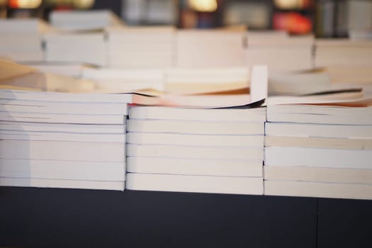 Neatly stacked blank books arranged beautifully in a serene and tranquil reading environment
