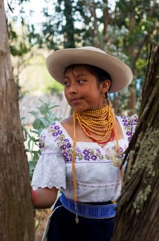 Ecuadorian Cultural Elegance: A Beaming 13-Year-Old Girl Radiates Beauty in Her Native Dress and Golden Jewelry, Amidst the Natural Splendor. High quality photo