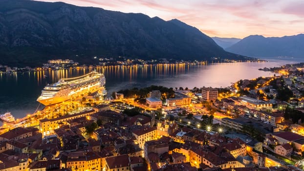 Top view of the old city of Kotor and the Kotor Bay with cruise ship at night. Montenegro