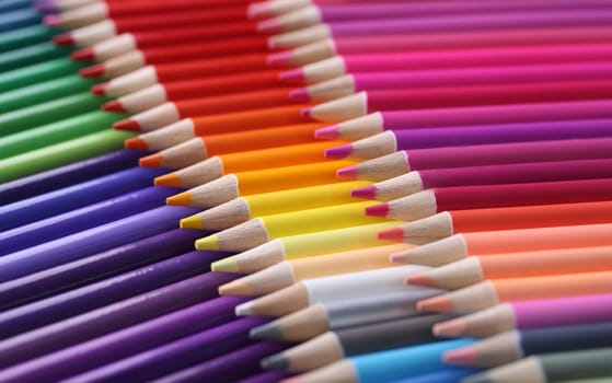 Colored pencils closeup. Collection of colored pencils in row concept