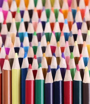 Closeup of assortment of colored pencils. Assortment stack of colored wood drawing pencils closeup