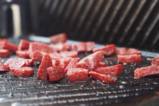 Fresh beef cubes are sizzling on the grill, ideal for grilling and delicious recipes