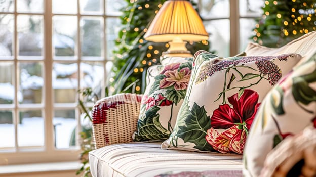 Colorful pillows on sofa against glass wall of window in a winter garden or conservatory. Interior textile concept. High quality photo