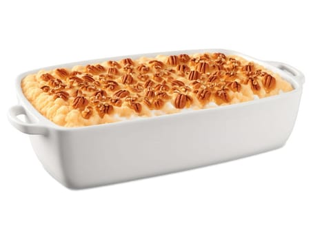 Sweet Potato Casserole A bubbling sweet potato casserole on a transparent background, with a fluffy sweet potato filling topped with..