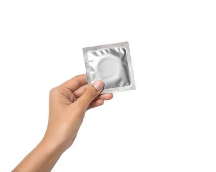 Condom in female hand, isolated on white background. Copy space.