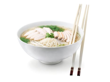 Pho Ga Vietnam Fragrant chicken noodle soup with rice noodles, sliced chicken and fresh herbs in traditional ceramic bowl with..