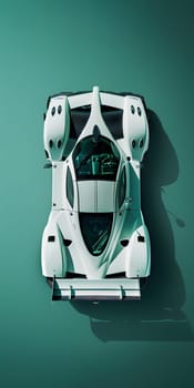 A white sports car seen from above, showcasing its sleek automotive design on a vibrant green background