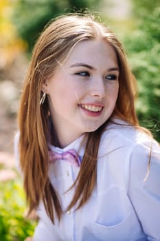 Portrait of a happy student wearing a bow tie and smiling on the first day of school