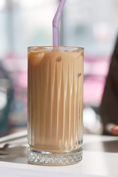 iced late in a transparent glass on cafe table ,