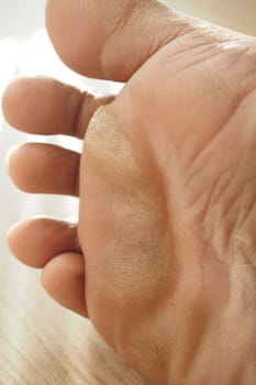 close up of young man dry feet on bed ,