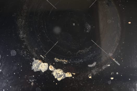 A black dirty electric stove. closeup