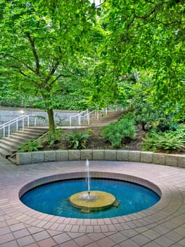 Small inner yard of residential area with fountain in downtown of Vancouver.