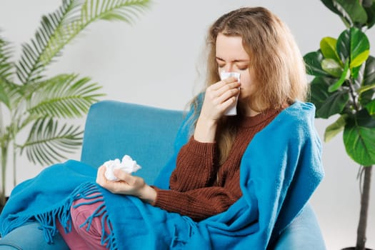 Sickness, seasonal virus problem concept. Woman being sick having flu lying on sofa. Sick woman lying in bed with high fever. Cold flu and migraine.