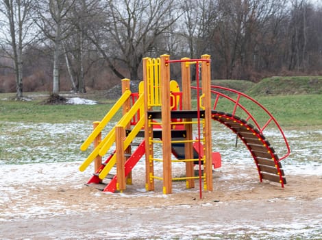Bright children's playground on the winter park