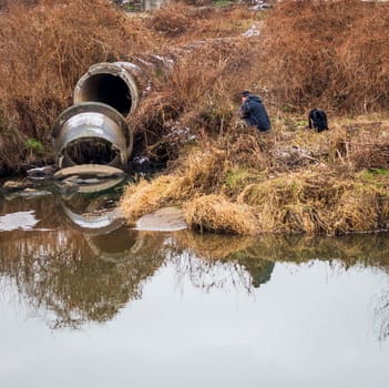 Shot of the man fishing on the winter river