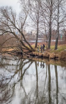 Shot of the men fishing on the winter river
