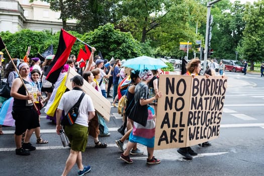 Poznan, Poland - 28 June 2024: March Of The Lgbt Community Featured Banners Supporting Refugees
