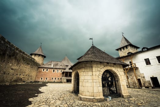 Khotyn, Ukraine - 15 July 2015: inside yard with houses and wooden stairs of Khotyn Fortress
