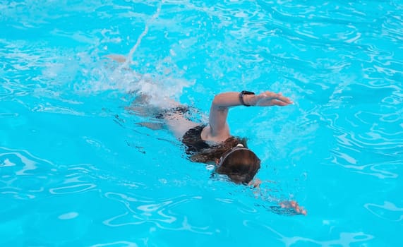 Young Girl Perfecting Front Crawl In Hotel Pool