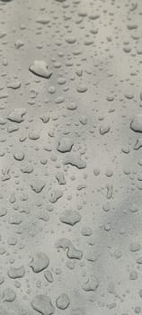 raindrops on gray background water weather. High quality photo