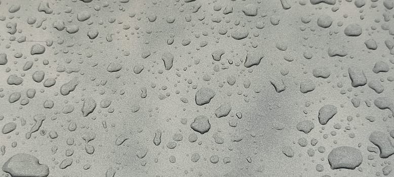 raindrops on gray background water weather. High quality photo