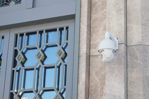 A wallmounted security camera offering extensive surveillance for diverse needs and locations