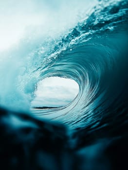 Massive wave, a surfer's dream. Powerful ocean, a perfect tube. Nature's force on display.