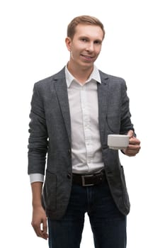 Handsome man in jacket and white shirt holding cup in his hand and smiling cropped isolated shot on white