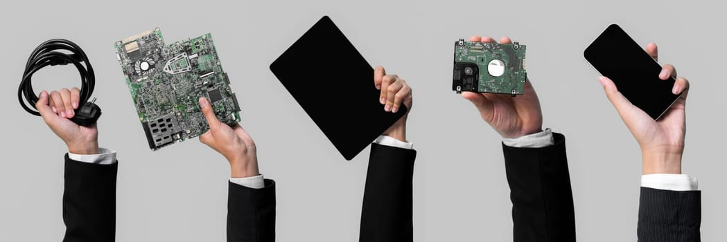 Panoramic banner hand holding electronic waste on isolated background. Eco-business recycle waste policy in corporate responsibility. Reuse, reduce and recycle for sustainability environment. Quaint