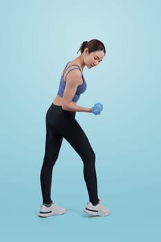 Vigorous energetic woman doing dumbbell weight lifting exercise on isolated background. Young athletic asian woman strength and endurance training session as body workout routine.