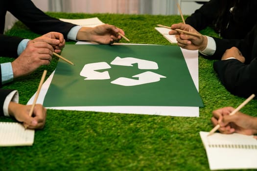 Recycle icon on meeting table in office with business people planning eco business investment on waste management as recycle reduce reuse concept for clean ecosystem. Quaint