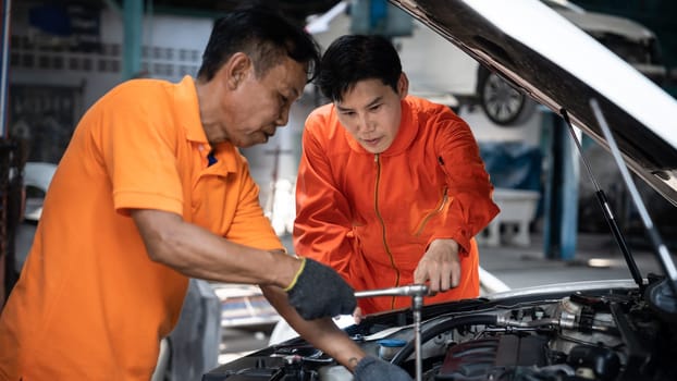 Panoramic banner automotive service mechanic inspect and diagnose car engine issue, repairing and fixing problem in workshop. Technician car care maintenance working on internal components. Oxus
