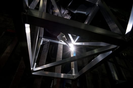 View of a worker doing argon welding at production plant