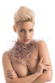 Gorgeous blonde topless wearing only bijouterie waist up isolated portrait