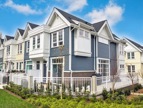 Brand new residential townhouses for sale on blue sky background