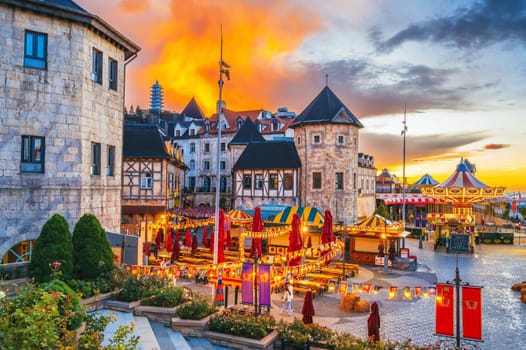 A medieval stone town in a French village in Ba Na Hills Park at sunset. Da Nang, Vietnam - September 13, 2024